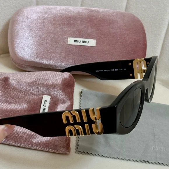 Miu Miu Black Oval Sunglasses with Gold Logo Temples - Picture 2 of 14